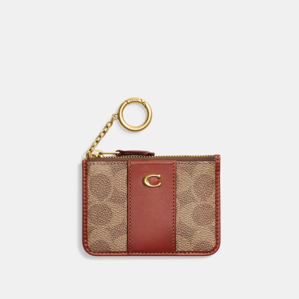 Compre Porta-cartões essential mini id signature coach com